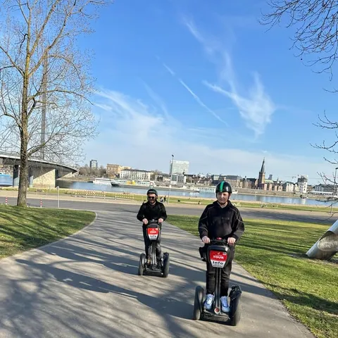 Two segway riders on the Rhine promenade