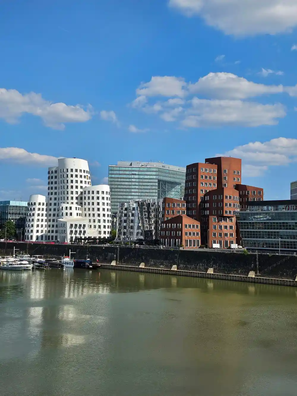 Riverside cityscape with colorful buildings and boats
